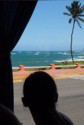 We see a local beach from the bus